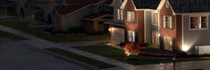 Home in an urban setting, at night, the only house with power.