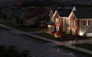 Home in an urban setting, at night, the only house with power.